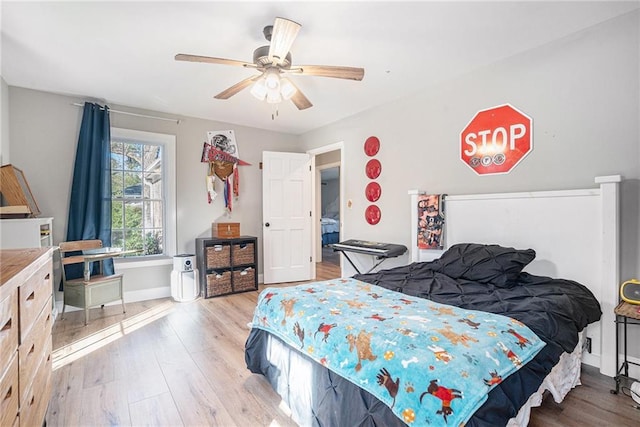 bedroom featuring ceiling fan and light wood-type flooring