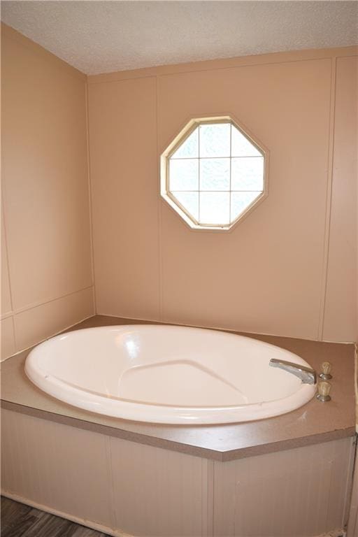 59 Pine Ridge Ln, White, GA 30184 - full bathroom featuring a bath and a textured ceiling