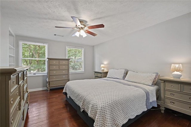 9470 Hillside Dr, Roswell, GA 30076 - bedroom with dark wood-type flooring, a textured ceiling, and ceiling fan