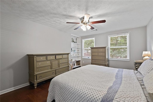 9470 Hillside Dr, Roswell, GA 30076 - bedroom featuring dark wood-type flooring, a textured ceiling, and ceiling fan