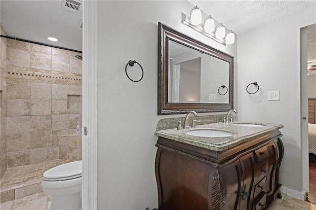 9470 Hillside Dr, Roswell, GA 30076 - bathroom with double vanity and a tile shower