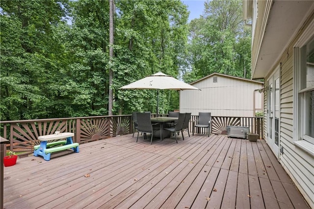 9470 Hillside Dr, Roswell, GA 30076 - wooden terrace with outdoor dining area and view of wooded area