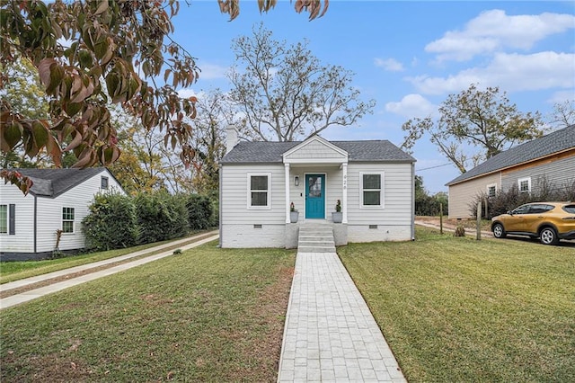 bungalow-style home featuring a front yard