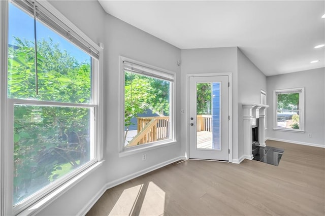 unfurnished living room with light hardwood / wood-style flooring