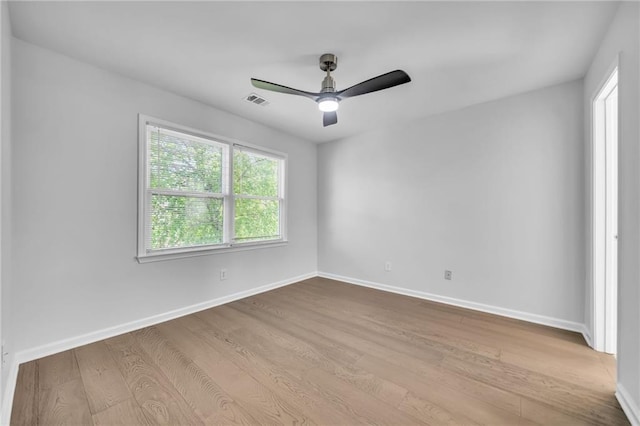 unfurnished room featuring ceiling fan and light wood-type flooring