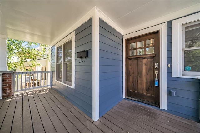 view of exterior entry with covered porch