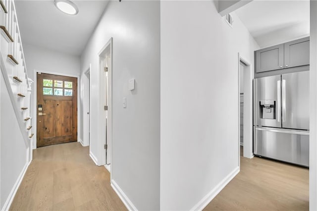 corridor featuring light hardwood / wood-style floors