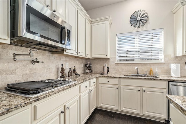 kitchen featuring white cabinets, stainless steel appliances, dark hardwood / wood-style floors, and sink