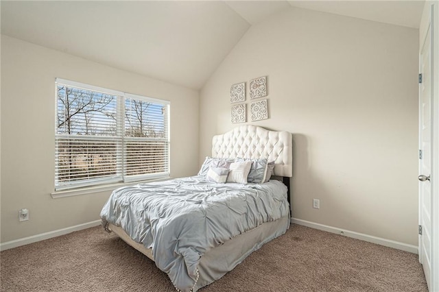 bedroom with lofted ceiling and carpet floors