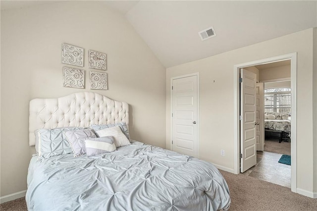 bedroom with lofted ceiling and carpet