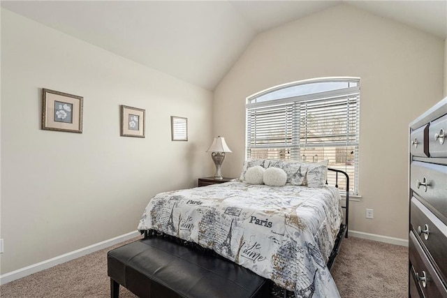 bedroom with light colored carpet and vaulted ceiling