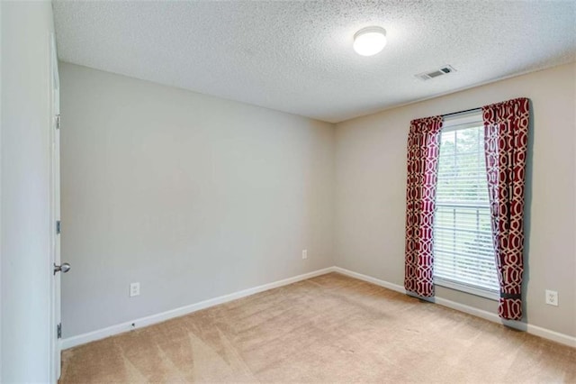 1227 Casper Ln, Winder, GA 30680 - empty room with light colored carpet, a textured ceiling, and baseboards