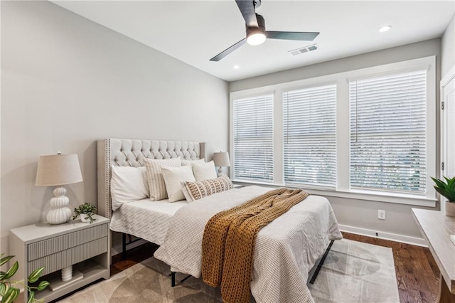 bedroom featuring ceiling fan and dark hardwood / wood-style floors