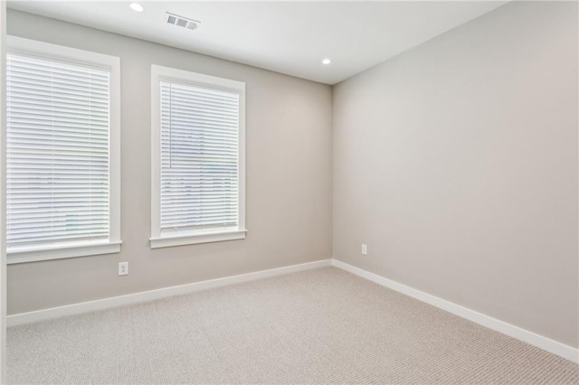 unfurnished room featuring carpet floors