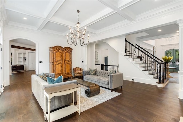 living room with arched walkways, stairway, coffered ceiling, and dark wood finished floors