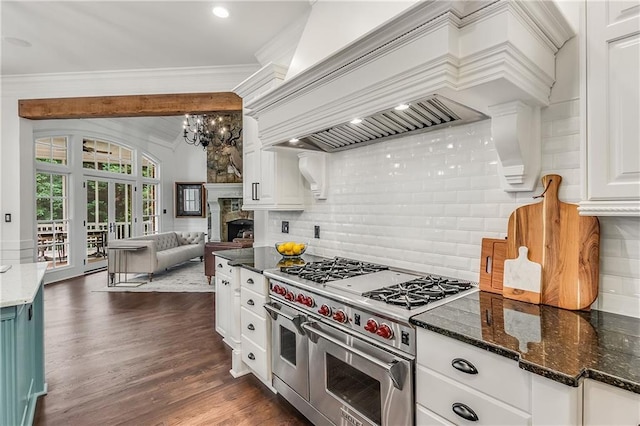 kitchen with premium range hood, dark wood-style flooring, open floor plan, ornamental molding, and double oven range