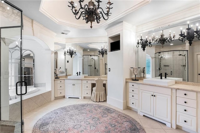 full bathroom with a stall shower, ornamental molding, a sink, and tile patterned floors