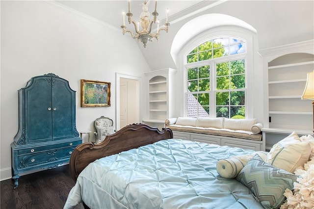 bedroom featuring ornamental molding, a closet, wood finished floors, and an inviting chandelier