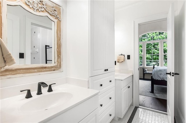 ensuite bathroom featuring vanity and ensuite bath