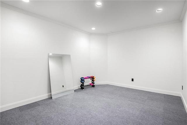 carpeted spare room with recessed lighting, crown molding, and baseboards