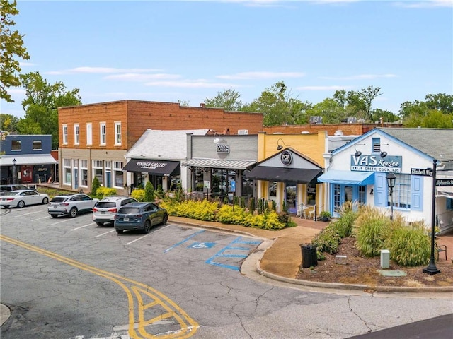 view of building exterior featuring uncovered parking