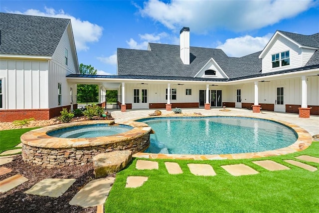 view of pool with ceiling fan, a patio area, an in ground hot tub, and french doors