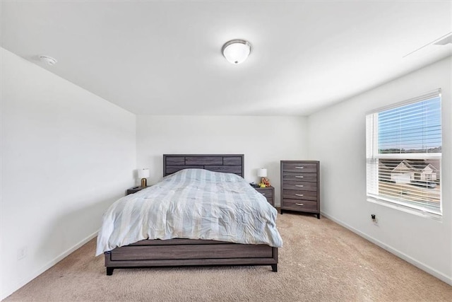 carpeted bedroom with baseboards