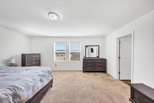 carpeted bedroom with baseboards