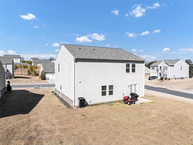 rear view of property with a residential view