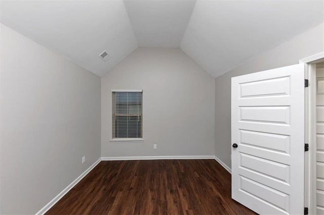 additional living space with lofted ceiling and dark wood-type flooring