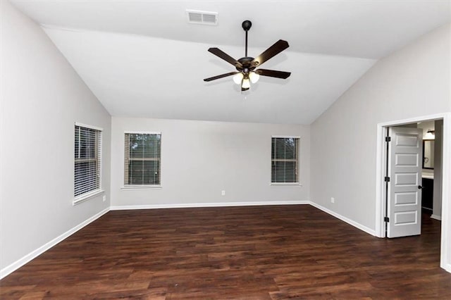 spare room with dark wood-type flooring, ceiling fan, and vaulted ceiling