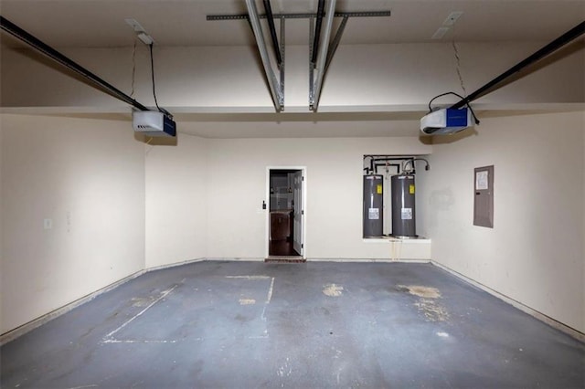 garage with a garage door opener, electric panel, and water heater