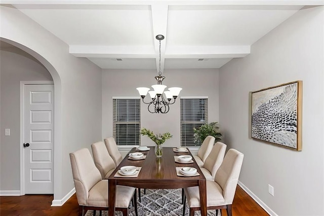 dining area featuring beamed ceiling, coffered ceiling, dark hardwood / wood-style flooring, and a notable chandelier