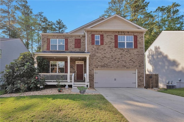 view of front of house featuring a front lawn, central AC, covered porch, and a garage