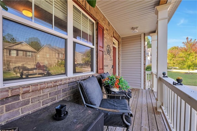 wooden terrace featuring a porch