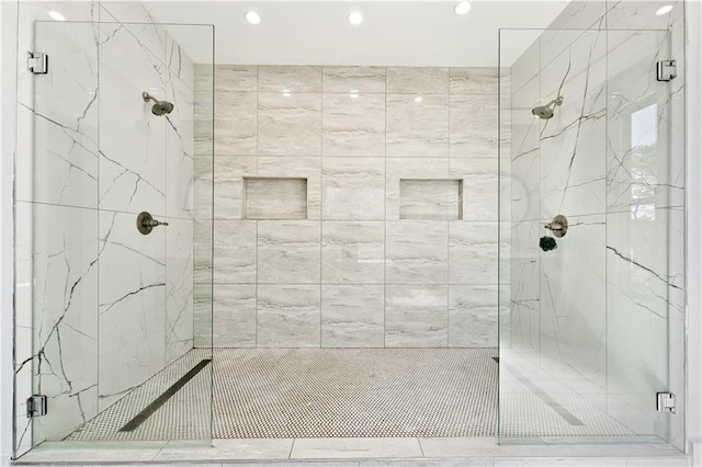 full bath with a marble finish shower