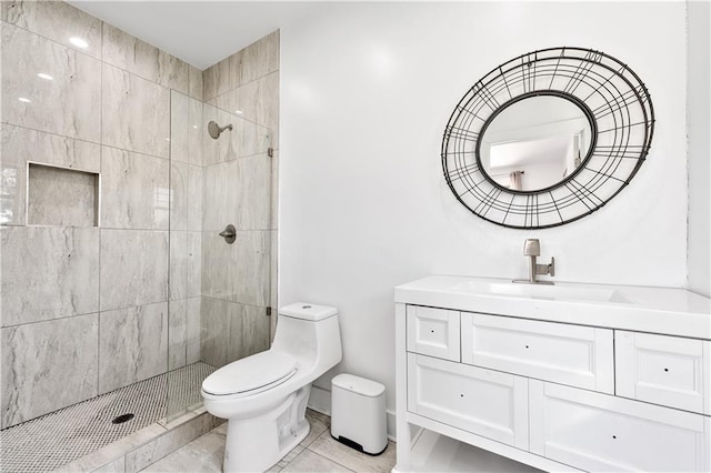 full bathroom featuring vanity, a shower stall, and toilet