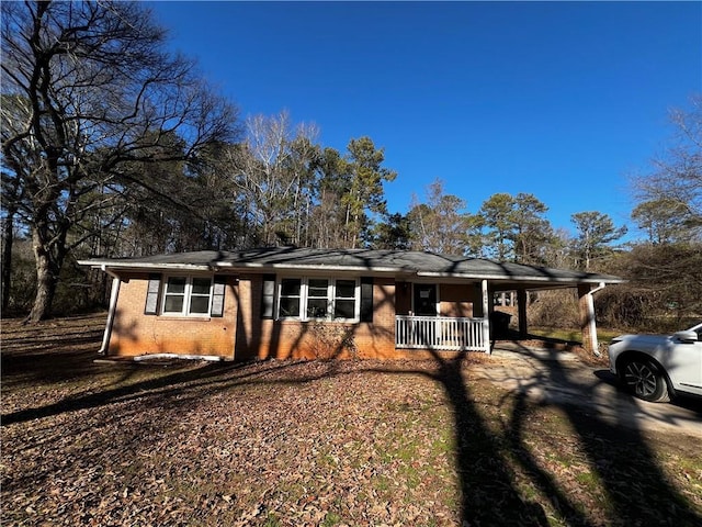 single story home with covered porch