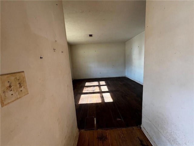 unfurnished room featuring hardwood / wood-style flooring