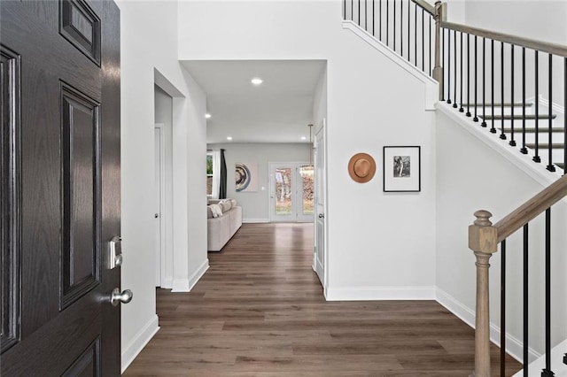 entryway featuring stairs, recessed lighting, wood finished floors, and baseboards