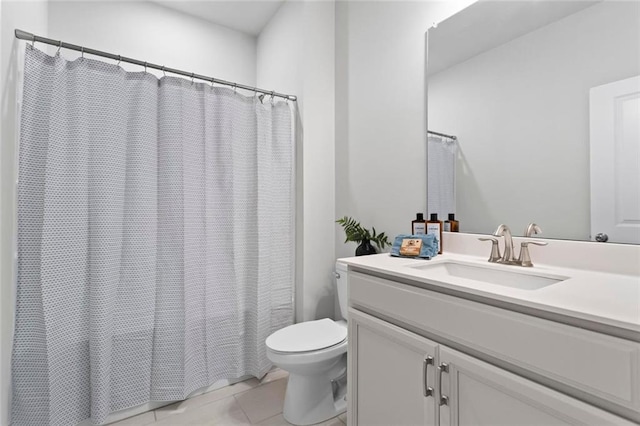 full bathroom featuring tile patterned flooring, curtained shower, toilet, and vanity