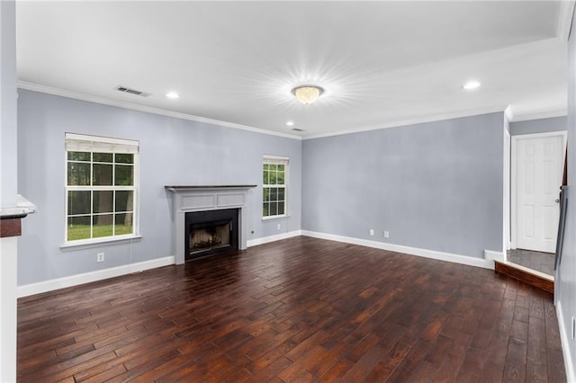 unfurnished living room featuring dark wood-type flooring and crown molding