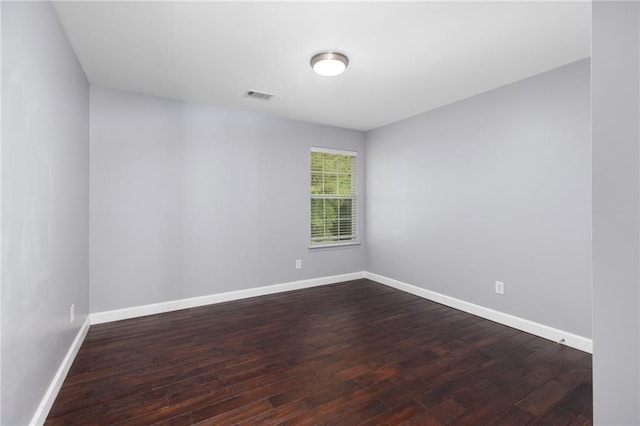 spare room with wood-type flooring