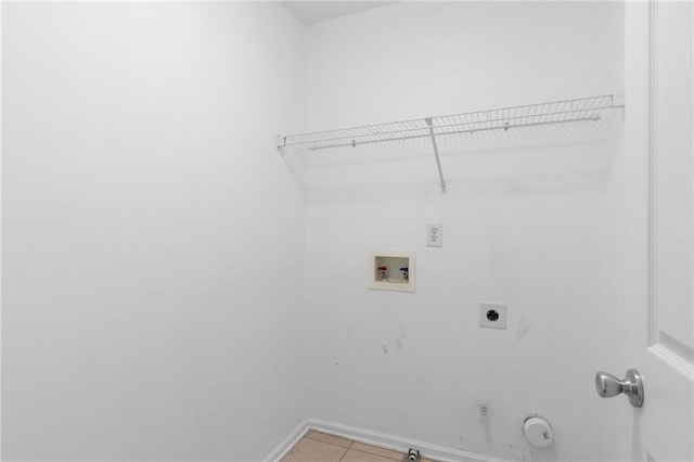 washroom with hookup for a washing machine, light tile patterned floors, gas dryer hookup, and electric dryer hookup