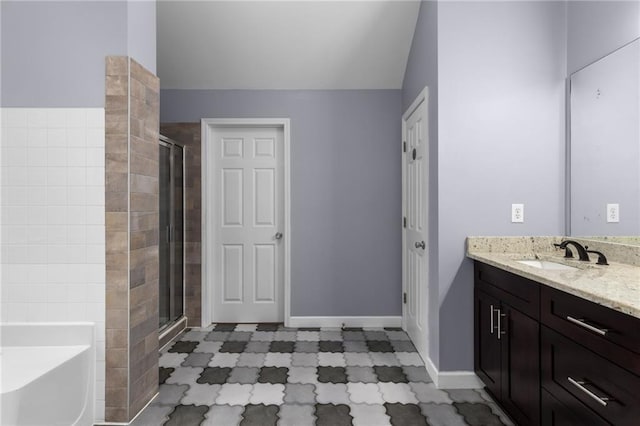 bathroom with independent shower and bath and vanity