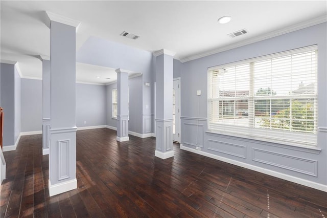 unfurnished living room featuring dark wood-type flooring, ornate columns, and ornamental molding