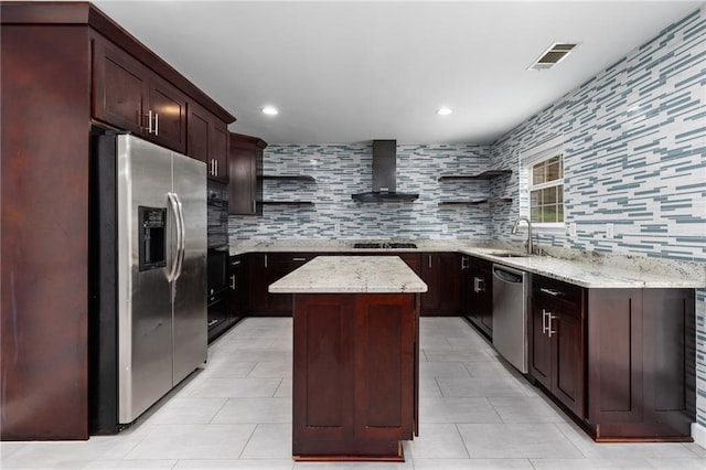 kitchen with stainless steel appliances, tasteful backsplash, a center island, wall chimney exhaust hood, and sink