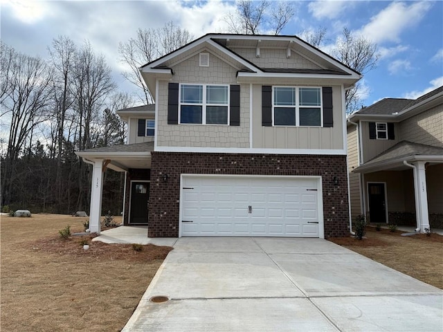 view of front of property featuring brick siding, driveway, and an attached garage