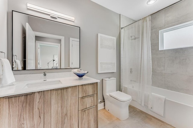 full bathroom featuring shower / bath combo, vanity, and toilet