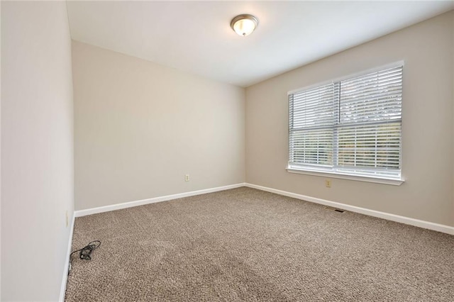 empty room featuring carpet flooring